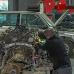 mechanic-repairing-car-engine-workshop